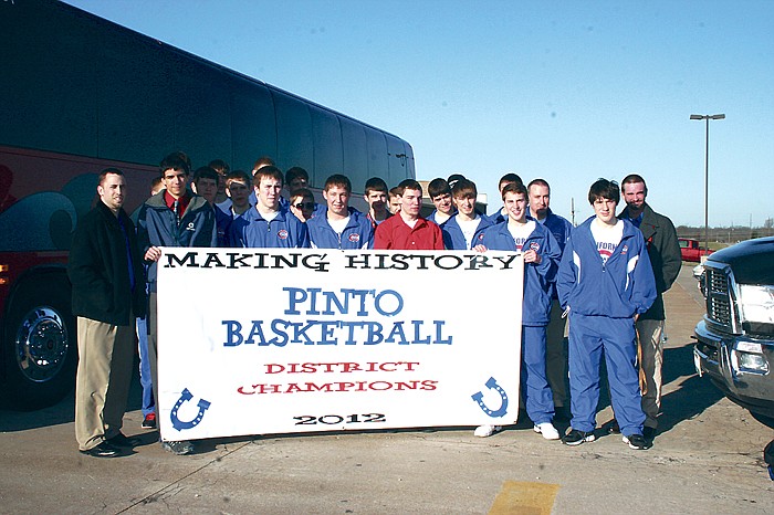 Members of the California Pinto varsity basketball team, coaches and managers proudly displayed their district championship banner Saturday morning at the high school before boarding the chartered bus to head to Springfield for Class 3 Quarterfinal play against Mt. Vernon. After winning the district title (the first since 1990 for the Pintos), California went on to defeat Blair Oaks 50-47 at Class 3 Sectionals March 7 at Rolla, then lost 55-45 to Mt. Vernon Saturday at Class 3 Quarterfinals at Springfield to end the season.