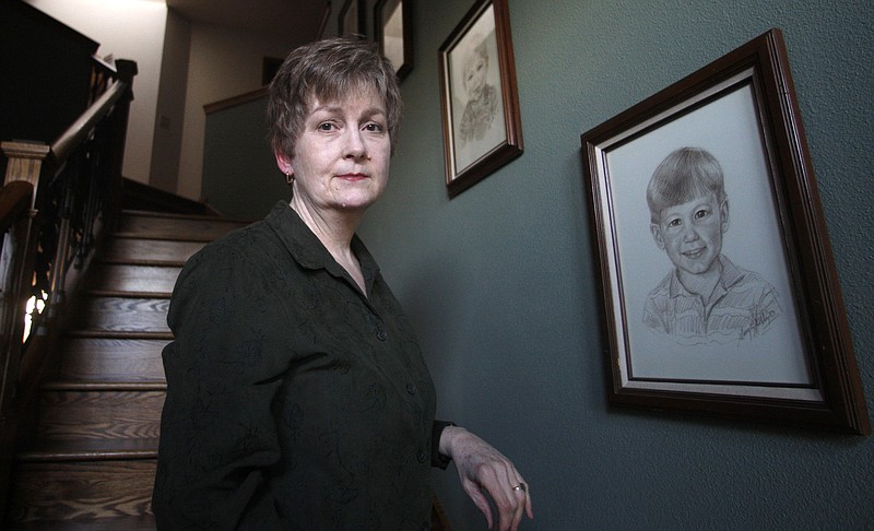Karen Williams stands next to a drawing at her Beaverton, Ore., home of her son Loren Williams, when he was a young boy. When Loren died in a motorcycle crash, the Oregon woman turned to his Facebook account in hopes of learning more about the young man she had lost. 
