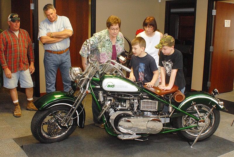 A custom biodiesel motorcycle built by Orange County Choppers and soon to debut on the Discovery Channel on Monday, makes a stop in Jefferson City at the National Biodiesel Board office. A crowd came out to get a look at this slick, clean-burning machine in person before it moves on to its next stop in Louisville, Ky, next week. 