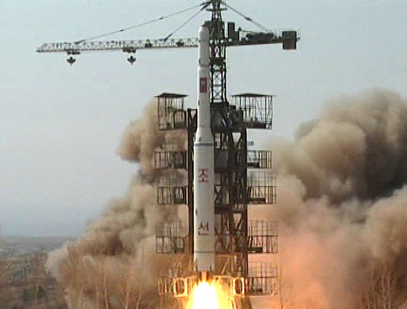 A rocket is lifted off from its launch pad in April 2009 in Musudan-ri, North Korea. North Korea announced Friday it plans to launch a long-range rocket mounted with a satellite next month, a surprise move that comes weeks after it agreed to nuclear concessions including a moratorium on long-range missile tests.
