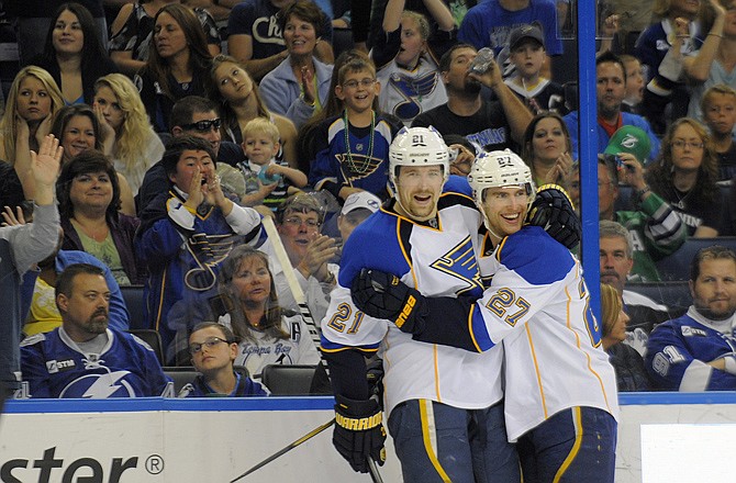 Blues center Patrik Berglund (left) celebrates his first period goal with defenseman Alex Pietrangelo during Saturday's game against the Lightning.