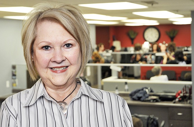 Marilyn Sharp, owner of Merrell School of Beauty, poses in the cosmetology section at the Jefferson City school.