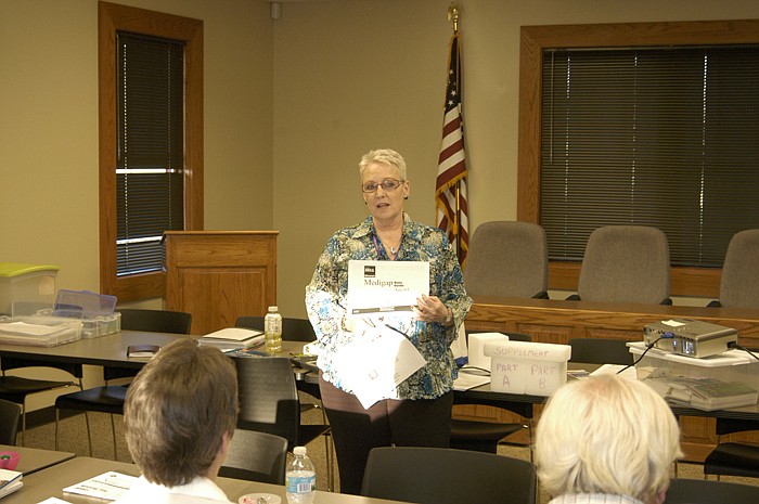 Kay Barbee, representing the Central Missouri Area Agency on Aging presents a "Medicare Boot Camp" session at the California City Hall Tuesday, March 13.