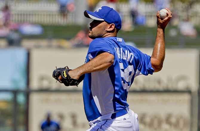 Kansas City Royals starting pitcher Felipe Paulino throws a pitch during a spring training baseball game Tuesday, March 20, 2012 in Surprise, Ariz. 
