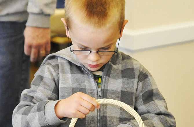 In this file photo from 2011, Ben Kuhlman counts his Easter eggs at that year's Heisinger Bluffs Easter Egg Hunt and bake sale. 