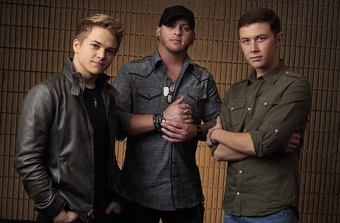 This March 8, 2012 photo shows Hunter Hayes, left, Brantley Gilbert, center, and Scotty McCreery, right, in Nashville, Tenn. The fan-voted top new artist category at the Academy of Country Music Awards features all three.