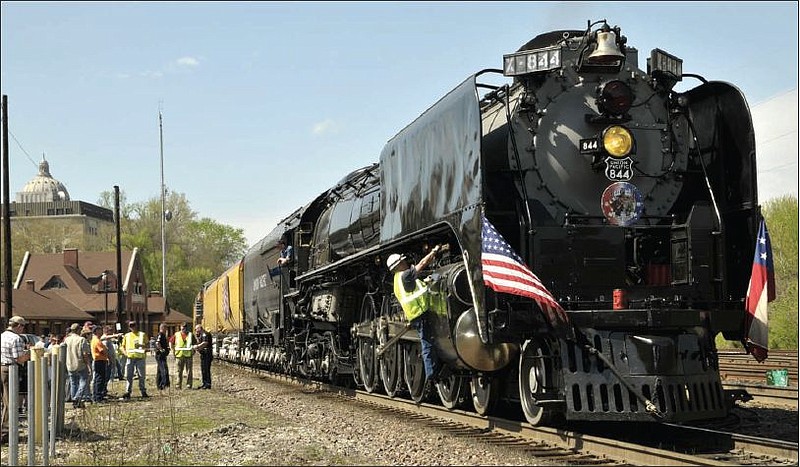 Workmen tend to the Union Pacific No. 844 steam engine Tuesday afternoon, March 27, 2012 on its stop in Jefferson City. 