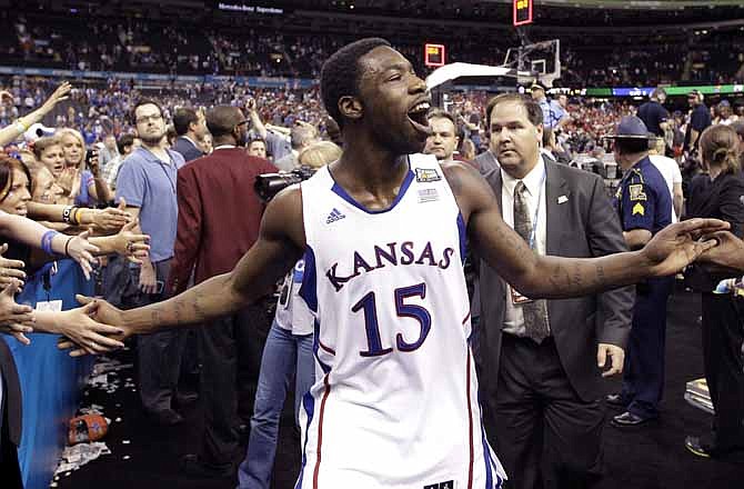 Kansas guard Elijah Johnson (15) celebrates after their 64-62 win over Ohio State in an NCAA Final Four semifinal college basketball tournament game Saturday, March 31, 2012, in New Orleans.