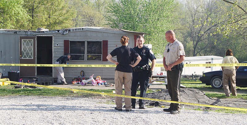 Law enforcement officers Monday block off access to the scene of a shooting that resulted in the death of Timmy E. Simpson of Williamsburg early Monday morning west of Fulton. Simpson was shot by a Callaway County deputy and a Mssouri State Highway patrolman. The officers reported Simpson leveled a handgun at them. The officers shot and killed Simpson.