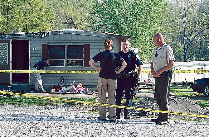 Law enforcement officers block access to the scene of a Monday shooting that resulted in the death of Timothy Simpson, 34, Williamsburg, who was shot by a Callaway County deputy and a Missouri Highway patrolman.
