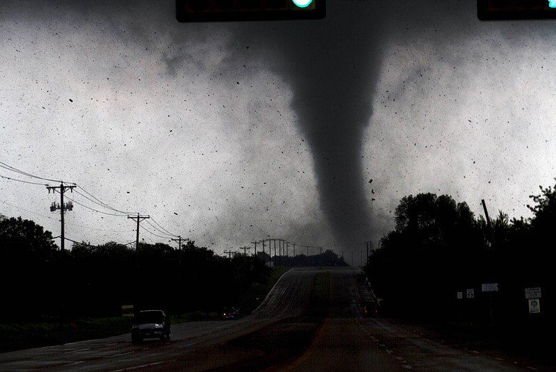 
A tornado touches down in Lancaster, Texas, south of Dallas on Tuesday. Tornadoes tore through the Dallas area, peeling roofs off homes, tossing big-rig trucks into the air and leaving flattened tractor-trailers strewn along highways and parking lots. 