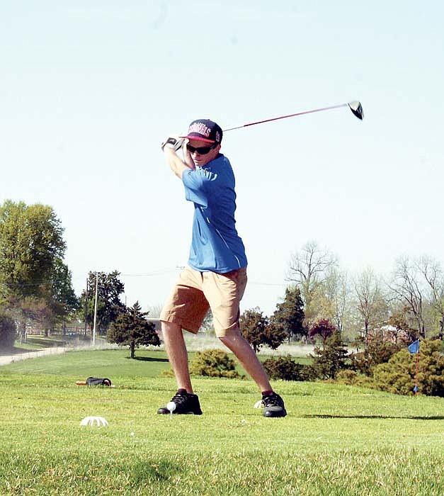 California's Eric Birdsong tees off at the varsity golf match Monday, April 2, at the California Country Club.