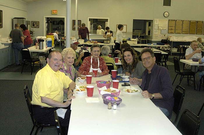 At the Moniteau County Historical Society Chili Supper Saturday, March 31, Paul and Dorothy Jungmeyer, left, dine with Chris and Jan Harris, right. Carol Schroeder, center, joins them briefly. The Harris's are known on stage as "Rodeo and Juliet" and performed at the Finke Theatre later in the evening. 