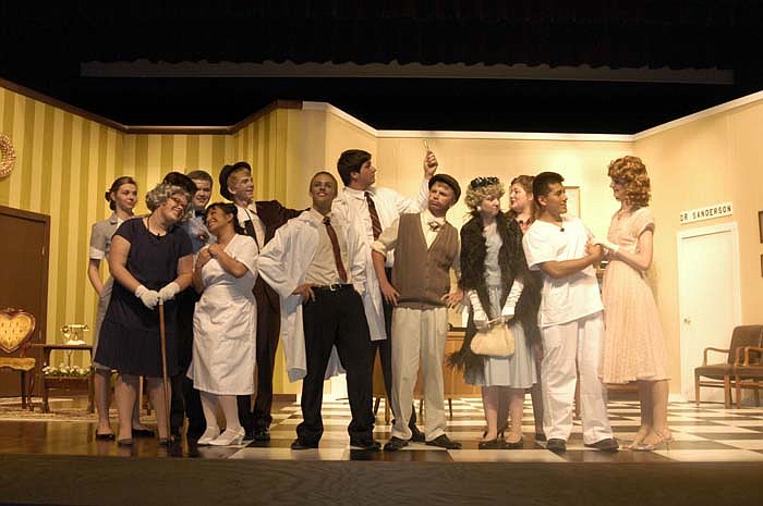 The stage cast of the CHS Drama Club presentation of "Harvey" has fun on stage after the play ends.