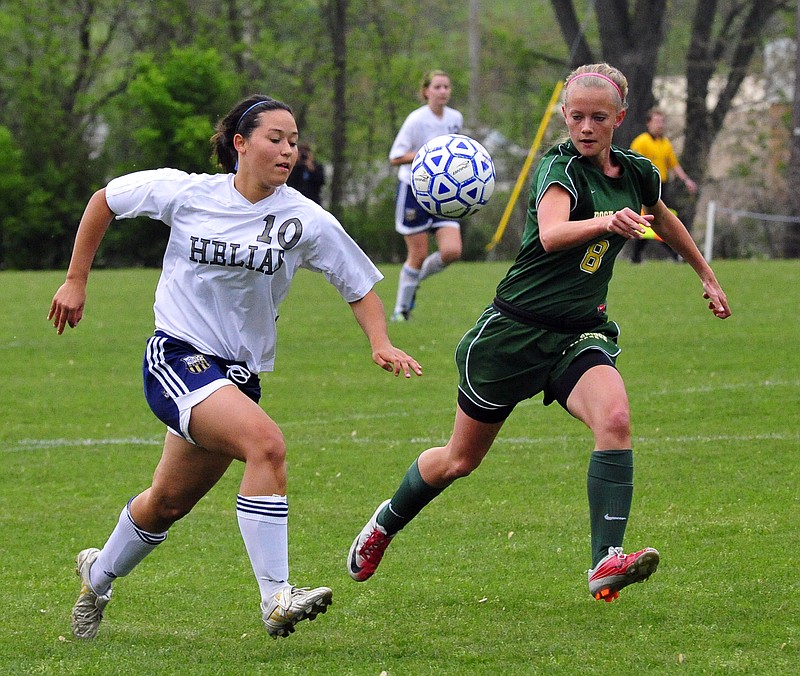 Alexis Melcher of Helias battles Kenzie Jacoby of Rock Bridge for possession during Wednesday's game at the 179 Soccer Park. Helias won the game 3-2 in penalty kicks. 