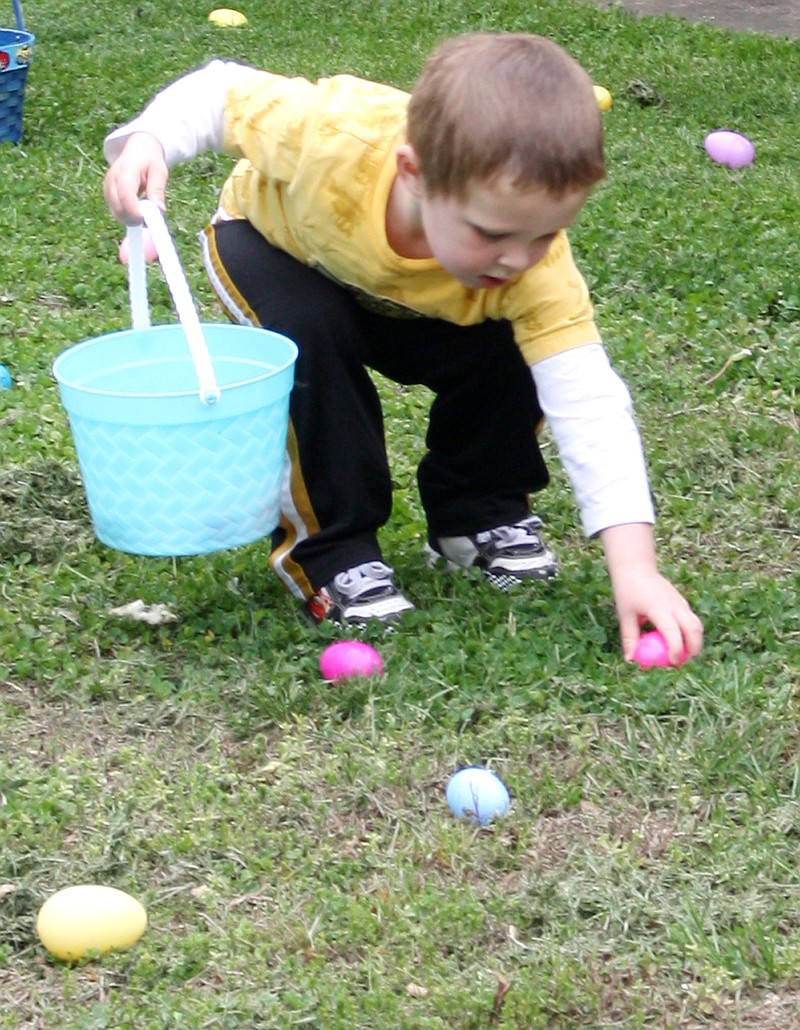 Two-year-old Josiah Carroll, son of James and Amanda Carroll of Fulton, finds an egg Saturday morning during an Easter Egg Hunt near the Humphrey Pavilion at Veterans Park in Fulton. The hunt was sponsored by the First Baptist Church of Fulton.