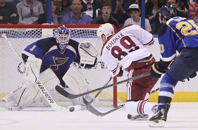 Phoenix Coyotes right wing Mikkel Boedker shoots and scores past St. Louis Blues goaltender Brian Elliott in the third period of an NHL hockey game on Friday, April 6, 2012, in St. Louis. (AP Photo/The St. Louis Post-Dispatch, Chris Lee)
