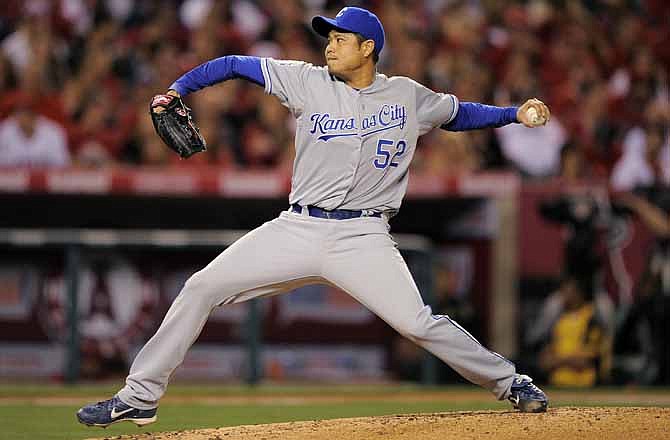 Kansas City Royals starting pitcher Bruce Chen throws to the plate during the fourth inning of their baseball game against the Los Angeles Angels, Friday, April 6, 2012, in Anaheim, Calif. 