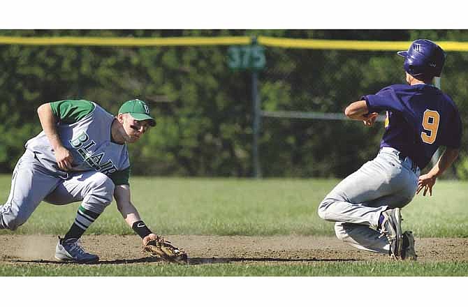 Blair Oaks shortstop Austin Kempker waits to apply the tag as Hickman's Garrett Dishinger is caught attempting to steal second base during a first-round game Friday in the Capital City Invitational at American Legion Field in Jefferson City.