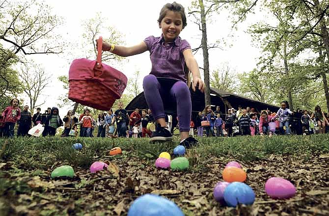 A lightning quick egg hunter gets the jump on the rest of the 4- to 5-year-olds as she prepares to load up her basket during Saturday's 27th annual Easter egg hunt, co-sponsored by the Jefferson City Jaycees and the Parks and Recreation Department at Memorial Park.