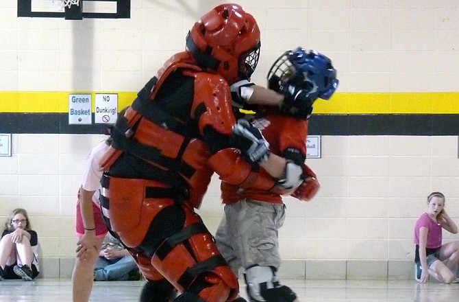 Fifth-grade students from Teresa Courter's class use their radKIDS' skills to demonstrate how they could get away from an attacker during a radKIDS graduation.