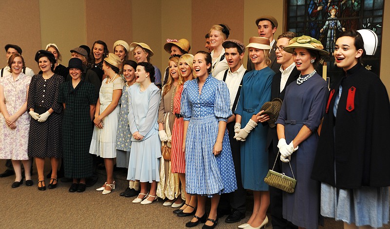 Helias students decked out in 1930s-era garb entertain residents with a chorus of "God Bless America" Thursday afternoon, at St. Joseph Bluffs. They were part of a group of 73 students in Mike Jeffries' advanced placement American history class visiting residents at retirement communities.
