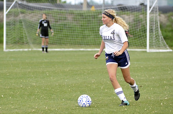 Alex Heislen handles the ball for the during the Crusader's 7-0 win against Hannibal on Thursday at the 179 Soccer Park.