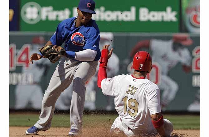 St. Louis Cardinals' Jon Jay (19) steals second as Chicago Cubs shortstop Starlin Castro applies the late tag in the fifth inning of a baseball game, Saturday, April 14, 2012 in St. Louis.