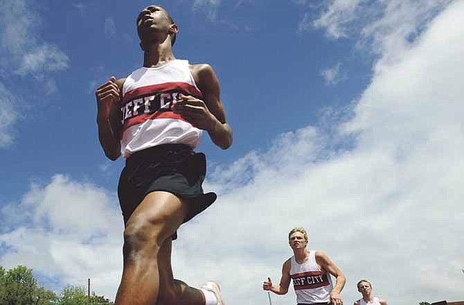 Members of the Jefferson City Jays take on the boys 1,600-meter run on Saturday.