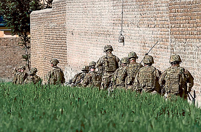 American soldiers respond after a suicide attack on the US-led provincial reconstruction team (PRT) compound east of Kabul, Afghanistan, on Sunday.