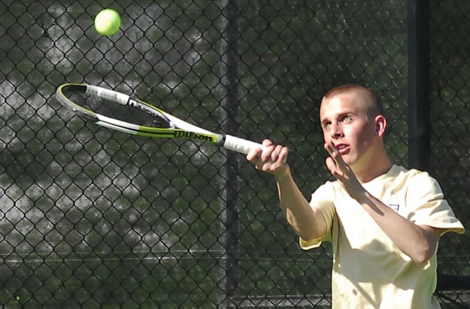 Patrick Remis of Helias lobs a shot toward the net during the Crusaders match against Marshall on Wednesday at Washington Park.