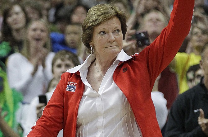 Tennessee coach Pat Summitt  waves to the crowd during a half-time ceremony at the NCAA Women's Final Four earlier this month in Denver. Summitt, the sport's winningest coach, is stepping aside as Tennessee's women's basketball coach and taking the title of "head coach emeritus."