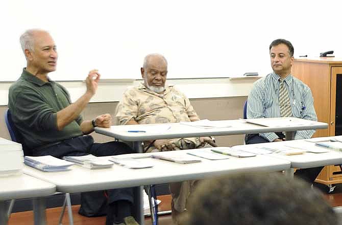 Panelist Ikbal Chowdhury, left, talks about being one of the many faces of Islam during a discussion about traditions of faith on Thursday at Lincoln University. He is joined by panel moderator Sultan Ahmad, center, and Noaman Kayani. All three are professors at the university.