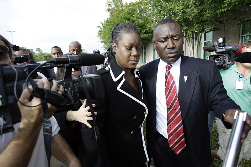 Sybrina Fulton, left, mother of Trayvon Martin and attorney Benjamin Crump, arrive at the Seminole County Criminal Justice Center Friday for a bond hearing for George Zimmerman, the neighborhood watch volunteer charged with murdering Trayvon Martin in Sanford, Fla.