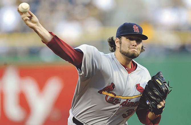 St. Louis Cardinals relief pitcher Lance Lynn (31) delivers against the St. Louis Cardinals during the first inning of a baseball game on Friday, April 20, 2012, in Pittsburgh.