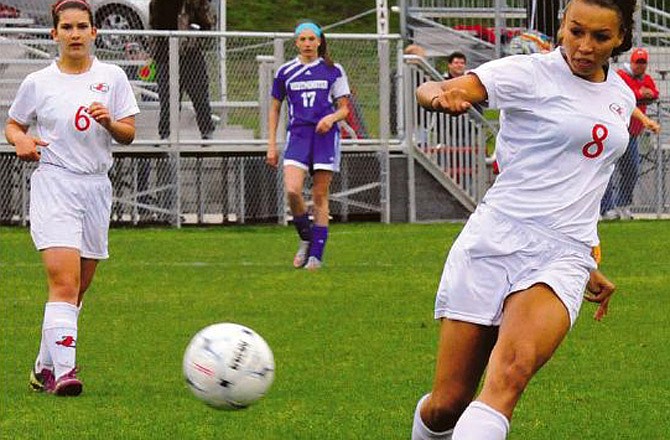 Jefferson City's Ashley Clark kicks in the first goal against Westminster on Friday in the first round of the Capital City Invitational at the 179 Soccer Park.