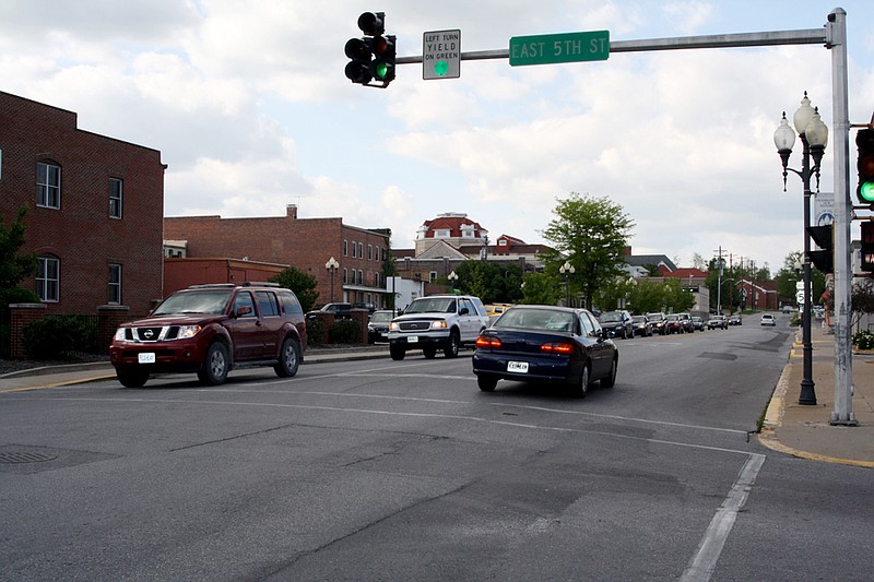 A line of cars waits to get through the intersection at 5th and Market. City Council today will consider whether to conduct a traffic study determining the stoplight's necessity there.