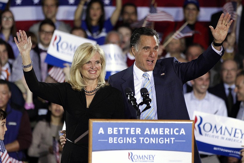 Republican presidential candidate Mitt Romney, and his wife, Ann, wave Tuesday at an election night rally in Manchester, N.H. Romney added to his big lead in the race for convention delegates Tuesday with a five-state sweep of Republican presidential primaries. 