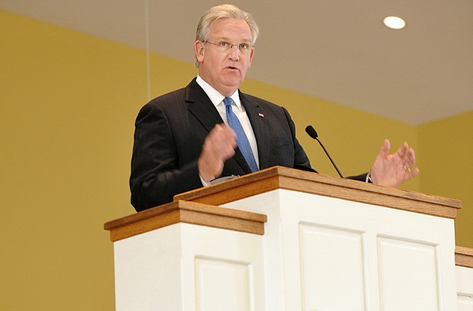 Attendees of the Missouri Faith-Based Organization Disaster Initiative Workshop listen to Gov. Jay Nixon as he addresses the group about emergency preparedness.