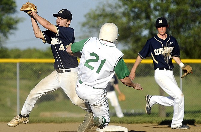 Helias second baseman Logan Gaines gets set to put a tag on Blair Oaks' Derek Otto on a steal attempt during the fourth inning of Tuesday's game at the Falcon Athletic Complex. Otto was out on the play.