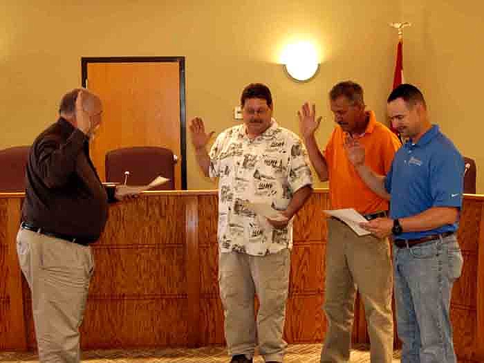 On Monday, April 16, from left, City Clerk Brian Scrivner swears in City of California Aldermen Joe Coffelt, Lanny Ash and Kelly D. Messerli.