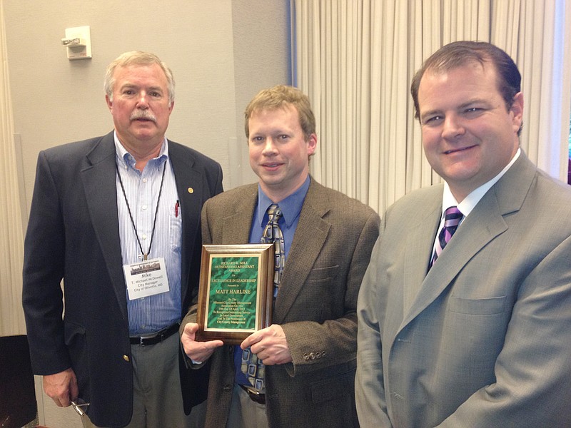 Fulton Assistant Director of Administration Matt Harline (center) is presented with the Richard R. Noll Outstanding Assistant Award by the Missouri City/County Management Association. Also pictured are Mike McDowell (left) city manager for the City of Olivette, the nominating committee chair, and George Liyeos (right), city administrator of Rock Hill and immediate past president of the MCCMA.