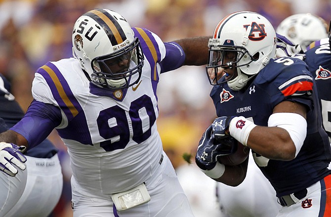 The Rams selected LSU defensive tackle Michael Brockers (90) with the 14th overall pick in the first round of Thursday night's NFL draft in New York City.