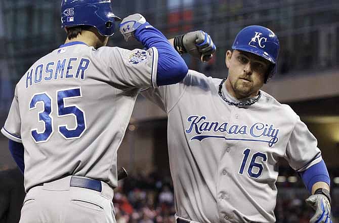 Kansas City Royals' Eric Hosmer, left, congratulates Billy Butler on his two-run home run off Minnesota Twins pitcher Carl Pavano in the third inning of a baseball game, Friday, April 27, 2012, in Minneapolis.