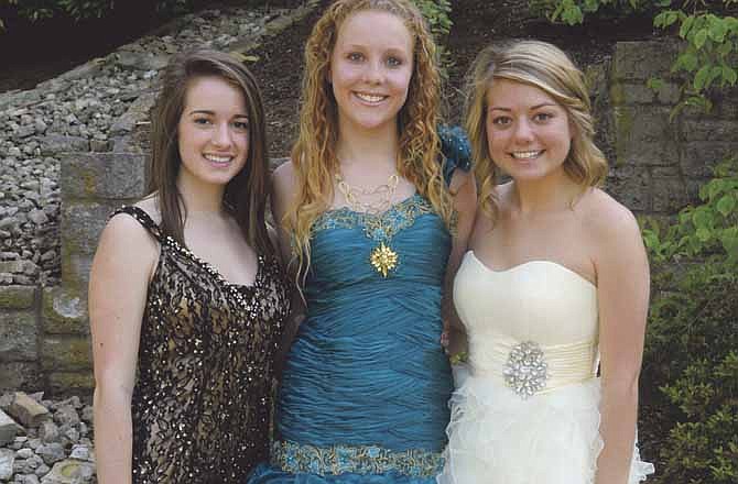 Erin Mills, left, Chloe Armstrong and Cassiday Schrimpf, right, are the 2012 Helias Prom Court.
