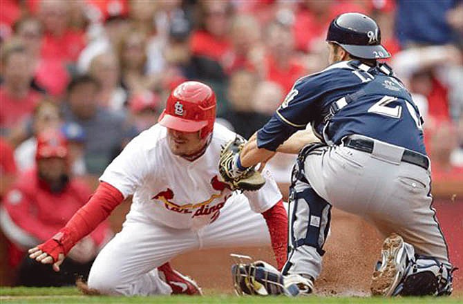 The Cardinals' Tyler Greene is tagged out by Brewers catcher Jonathan Lucroy for the final out of Sunday's game in St. Louis. The Brewers won 3-2.