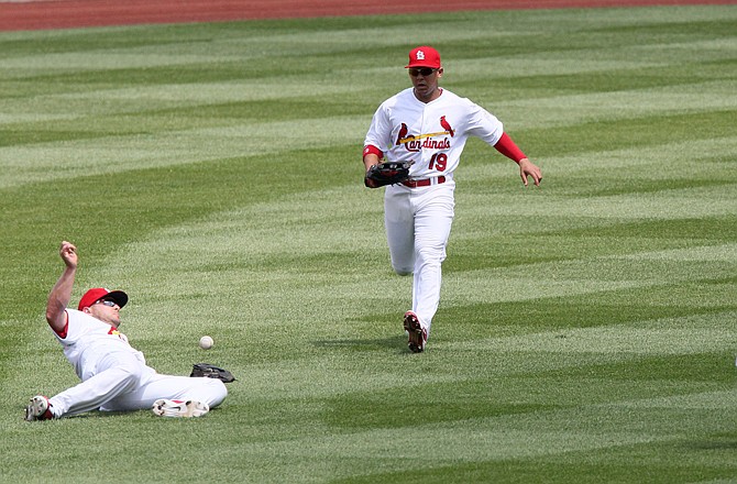 Cardinals leftfielder Matt Holliday (left) is unable to catch a ball hit by Pedro Alvarez of the Pirates in the fourth inning of Thursday afternoon's game at Busch Stadium. Also converging on the ball are Jon Jay (19) and Rafael Furcal (not pictured).