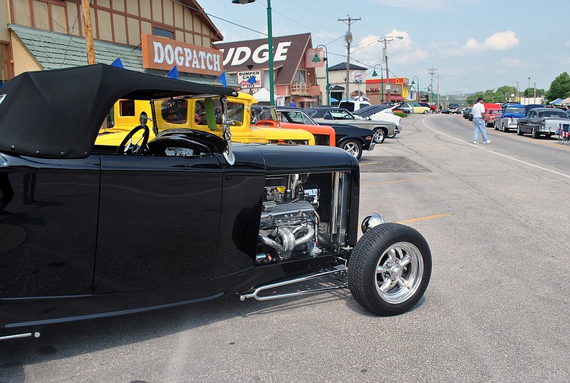 
Jefferson City resident Doug Mueller's 1932 Ford Roadster sits among many other beautifully restored classic cars during Friday's opening day of the 24th Annual Magic Dragon Street Meet Nationals event on Bagnell Dam Strip in Lake Ozark.
