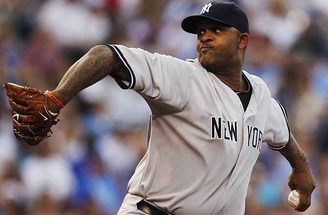 New York Yankees starting pitcher CC Sabathia delivers to Kansas City Royals' Jarrod Dyson during the first inning of a baseball game in Kansas City, Mo., Friday, May 4, 2012.