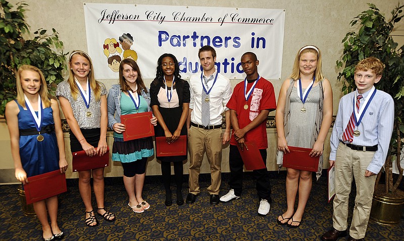 Kris Wilson/News Tribune
The Jefferson City Area Chamber of Commerce's Partners in Education program presented 10 local students with Youth Service Awards during its annual awards banquet at the Truman Hotel on Tuesday. Award winners were, from left, Jacquelyn Walker, Tayler LePage, Ali Robinson, Ishmeak Turner, Alex LeCure, Shaquille Kelly, Shae Lackman and Ben Scott. Not pictured are fellow award winners Kimberly Ousley and Kyle Maddox.